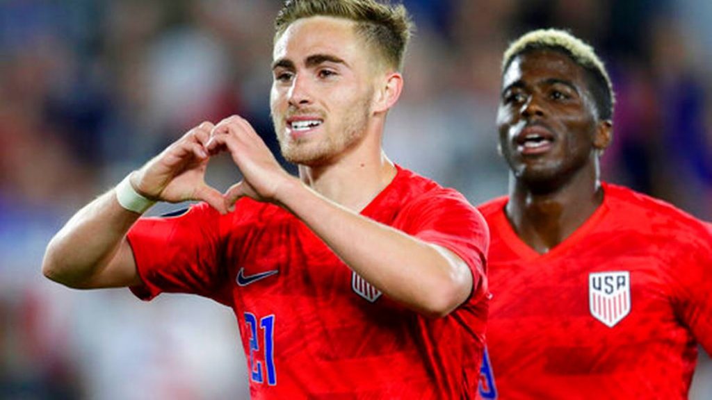 United States' Tyler Boyd, left, celebrates his goal against Guyana with fans as teammate Gyasi Zardes follows during the second half of a CONCACAF Gold Cup soccer match Tuesday, June 18, 2019, in St. Paul, Minn.