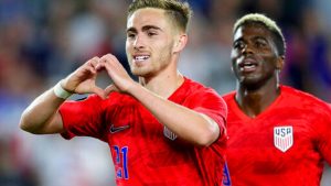 United States' Tyler Boyd, left, celebrates his goal against Guyana with fans as teammate Gyasi Zardes follows during the second half of a CONCACAF Gold Cup soccer match Tuesday, June 18, 2019, in St. Paul, Minn.