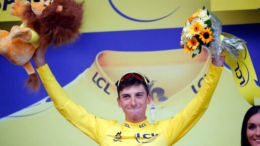 Italy's Giulio Ciccone celebrates with the overall leader's yellow jersey on the podium, at the end of the sixth stage of the Tour de France cycling race over 160 kilometers (100 miles) with start in Mulhouse and finish in La Planche des Belles Filles, France, Thursday, July 11, 2019.