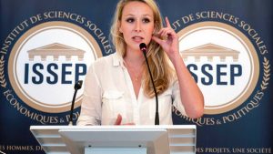 FILE - In this June 22, 2018 file photo, Marion Marechal delivers a speech as she inaugurates the Institute of Social Sciences, Economics and Politics (ISSEP) in Lyon, central France. She vowed to stay out of politics and even dropped the French far right's signature name _ Le Pen _ from her moniker. But Marion Marechal, a former star lawmaker who’s still only in her 20s, is now tip-toeing back into the political arena, and is already causing trouble. Widely seen as a potential party leader, the 29-year-old’s discreet meetings in recent days to build bridges with enemy conservatives are further unsettling the mainstream right.