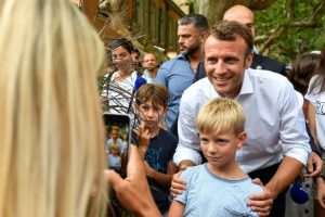 French President Emmanuel Macron (C) on Saturday posed for pictures in Bormes-les-Mimosas, near the fort of Bregancon where he will host his Russian counterpart Vladimir Putin in August (AFP Photo/GERARD JULIEN)
